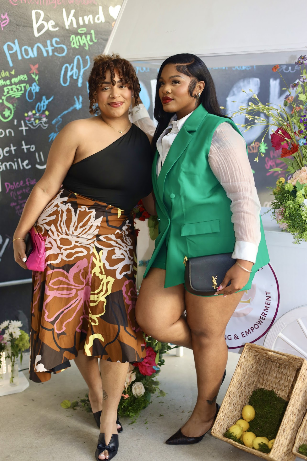 Two guests styled in bold color at a Circle of She gathering